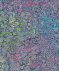 Multi-colored pastel blue, green, and pink boomerang pattern on dark gray handmade cotton batik fabric.