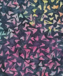 Vibrant pink, purple, and yellow boomerang geometric motifs on dark gray handmade cotton batik.