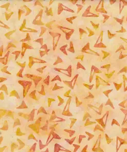 Earthy light yellow and cream handmade cotton batik fabric featuring warm orange geometric boomerang motifs.