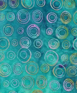 Bright cyan circle batik fabric wholesale with handmade wax-resist ring patterns for tropical apparel and craft projects.