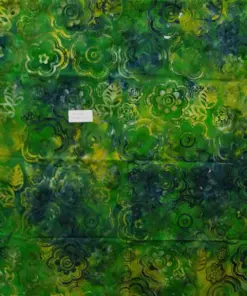 Lush tropical green, yellow, and navy blue large floral botanical batik print cotton fabric.