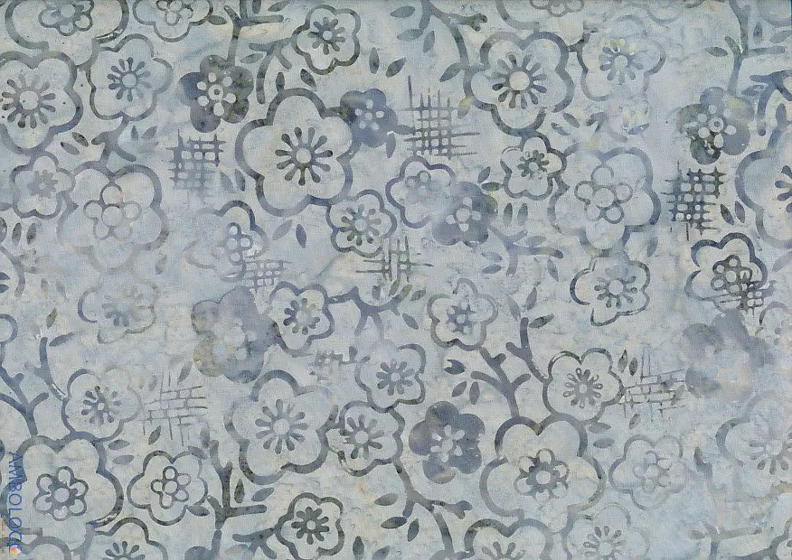 Close-up of light gray handmade Indonesian batik fabric featuring a delicate Jasmine floral pattern, perfect for quilting and sewing.