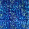 Ocean blue seahorse batik fabric with turquoise watercolor marine life motifs.