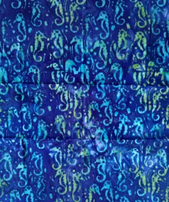 Ocean blue seahorse batik fabric with turquoise watercolor marine life motifs.