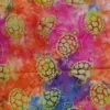 Vibrant sunset-colored batik fabric blending pink, orange, and blue with lime green sea turtle Hawaiian batik fabric for tropical projects.