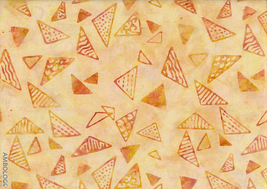 Light yellow and orange geometric batik fabric featuring hand-stamped triangle patterns for warm-toned quilting and apparel.