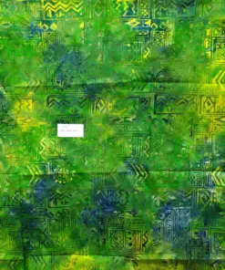 Authentic handmade Bali batik fabric featuring a vibrant green, yellow, and blue ethnic geometric pattern on 100% premium cotton for quilting and apparel.
