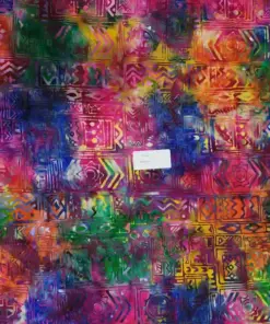 Vibrant rainbow ethnic Bali batik fabric featuring traditional geometric tribal motifs hand-stamped on pure cotton for creative sewing projects.