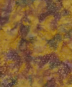Close up of authentic brown dotted batik fabric featuring an earthy, hand-dyed speckled pattern on 100% premium cotton, perfect for quilting and sewing projects.