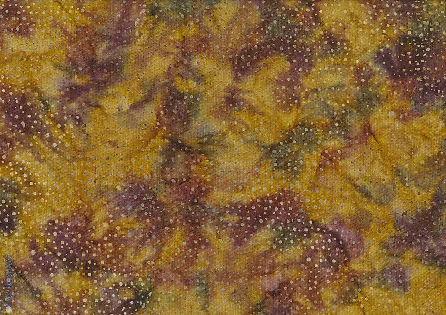 Close up of authentic brown dotted batik fabric featuring an earthy, hand-dyed speckled pattern on 100% premium cotton, perfect for quilting and sewing projects.