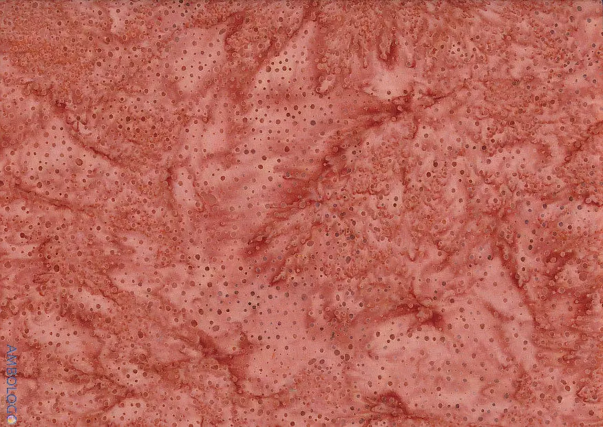 Textured light brown dotted batik fabric showcasing a warm terracotta rust tone on 100% cotton, ideal for earthy and vintage sewing projects.