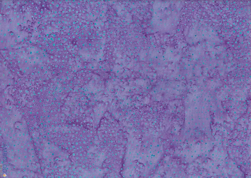 Bright light purple dotted batik fabric featuring an electrifying violet background with contrasting teal speckles on 100% premium artisan cotton.