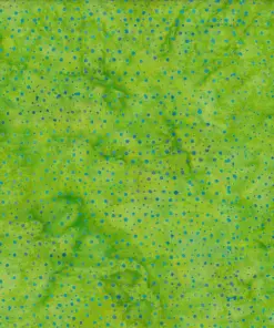 Bright lime green dotted batik fabric featuring vibrant blue speckles on 100% premium cotton, perfect for energetic, tropical sewing crafts