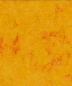 right orange dotted batik fabric featuring a warm, glowing speckled pattern on 100% premium cotton, perfect for vibrant sewing projects.