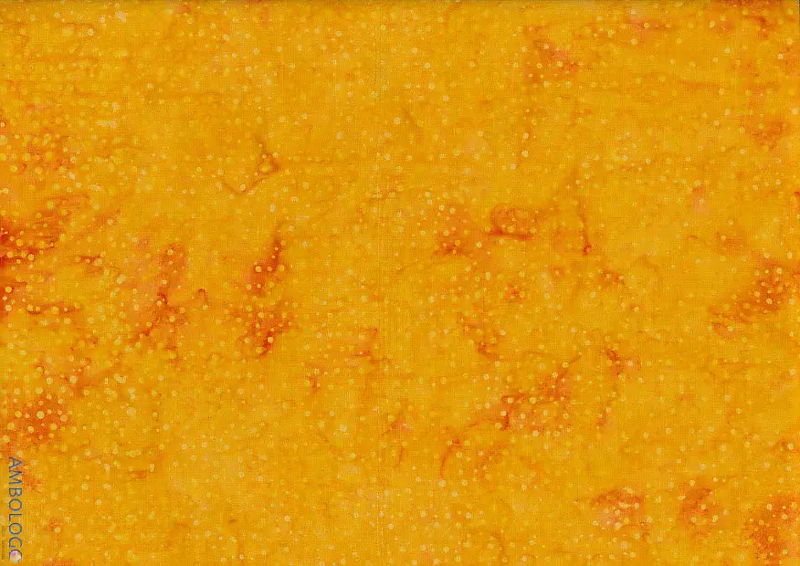 right orange dotted batik fabric featuring a warm, glowing speckled pattern on 100% premium cotton, perfect for vibrant sewing projects.