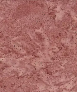Textured rosy brown dotted batik fabric featuring an earthy, warm reddish-brown hue with dark speckled patterns on 100% premium cotton.