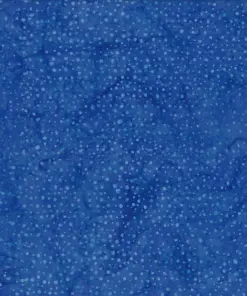 Rich sapphire blue dotted batik fabric displaying deep navy tones and vibrant light blue speckles on 100% premium cotton for elegant textile crafts.