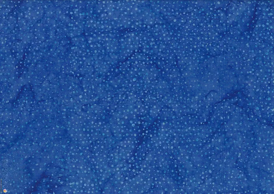 Rich sapphire blue dotted batik fabric displaying deep navy tones and vibrant light blue speckles on 100% premium cotton for elegant textile crafts.