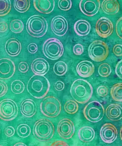Natural green circle batik fabric wholesale featuring hand-stamped concentric circles on breathable cotton for eco-friendly designs.