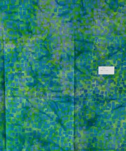 Luxurious green tosca and blue batik fabric with a small random geometric block pattern, hand-dyed artisan cotton.