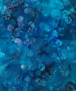 Ocean blue tropical batik fabric showing varying shades of turquoise, navy, and azure with playful pineapple patterns.