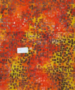 Intense fire pillar batik fabric with a dense small random geometric box pattern in red, yellow, orange, and dark grey.