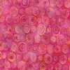 Vibrant pink circle batik fabric wholesale with handmade wax-resist ring motifs,