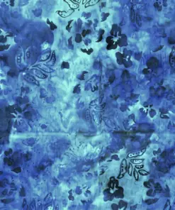 Moss and emerald green hand-stamped botanical batik fabric for quilting with delicate marigold patterns, made in Indonesia.
