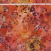 Autumn Bloom hand-stamped Marigold batik quilting fabric in sunset rust, orange, and amber with floral motifs, handmade in Pekalongan Indonesia.