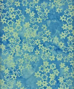Authentic winter blue and white Christmas Star Batik Fabric by the yard for holiday quilting and sewing projects.
