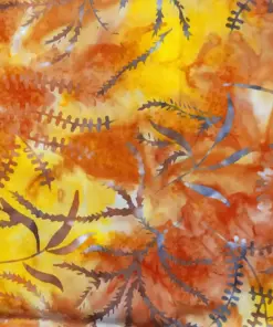 Warm autumnal Fern Yellow Orange batik quilt fabric by the yard displaying earthy Floral fern leaves on golden amber cotton.