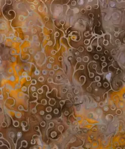 Golden brown and mustard yellow hand-stamped batik fabric featuring an abstract sea foam and coral reef motif.