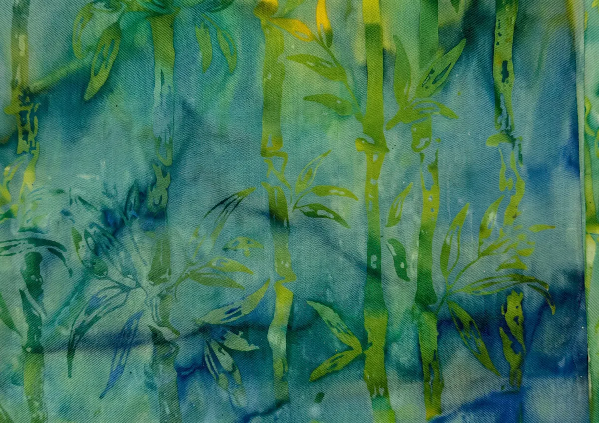 High-energy teal and turquoise batik fabric with vibrant green and yellow Bamboo Batik Fabric prints."