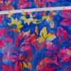 Vibrant ocean blue, fuchsia pink, and yellow Waikiki surf Hawaiian Plumeria Floral Batik Fabric made of premium cotton for summer dresses.