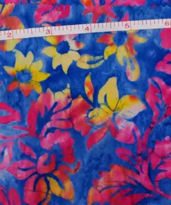 Vibrant ocean blue, fuchsia pink, and yellow Waikiki surf Hawaiian Plumeria Floral Batik Fabric made of premium cotton for summer dresses.
