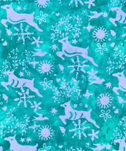 Frosty ice blue deer batik fabric with winter wonderland snowflakes and Christmas holiday motifs.