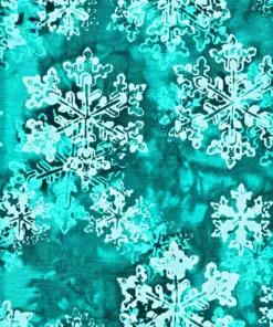 Close-up of ice blue Christmas Snowflake Bali Batik Fabric featuring traditional hand-dyed textures and winter holiday motifs.