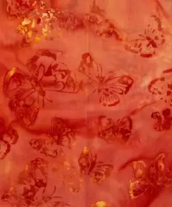 Vibrant orange butterfly tropical batik fabric featuring authentic wax-resist dyeing techniques.