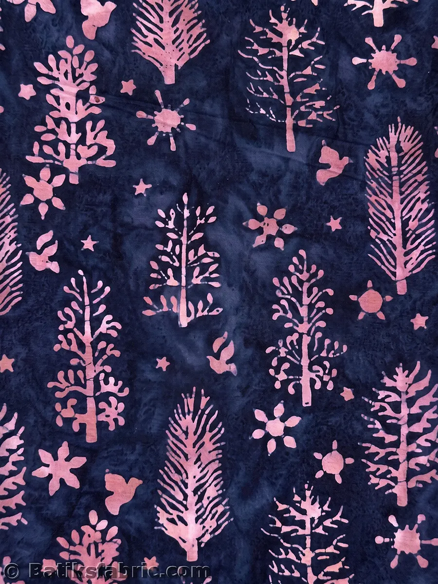 Midnight winter wonderland batik fabric featuring soft pink spruce trees, doves, and stars on a deep navy blue night sky background.