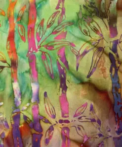 Vibrant rainbow multi-color batik fabric with intense pink and purple bamboo patterns.