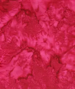 Close-up texture of authentic Indonesian red batik fabric featuring hand-dyed crimson pomegranate, watermelon rose, and dark claret wine tie-dye veins on 100% combed cotton for quilting
