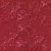 Close-up texture of red batik fabric by the yard showing Lush Island Cardinal, deep ruby garnet, and rosewood blush hand-dyed tie-dye marbling on 100% combed cotton.