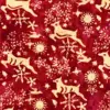 Classic red Christmas deer batik fabric with traditional reindeer, snowflakes, and festive holiday elements.