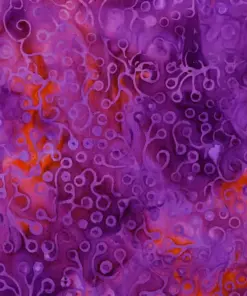 Vibrant purple and orange jewel-toned batik fabric displaying intricate coral reef and deep sea anemone patterns.