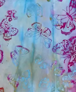 Pastel violet and arctic blue tropical butterfly batik fabric for delicate quilting projects.