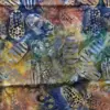 Marbled yellow, brown, and dark blue flip-flop print authentic handmade quilting cotton batik fabric.