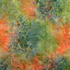 Close-up of hand-dyed green and orange tropical banana leaf batik fabric showing watercolor texture and hand-stamped botanical motifs.