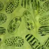 Bright lime green hand-stamped sandal motif 100% cotton batik quilting fabric. Title: Bright Lime Green Sandal Motif Batik Cotton Fabric